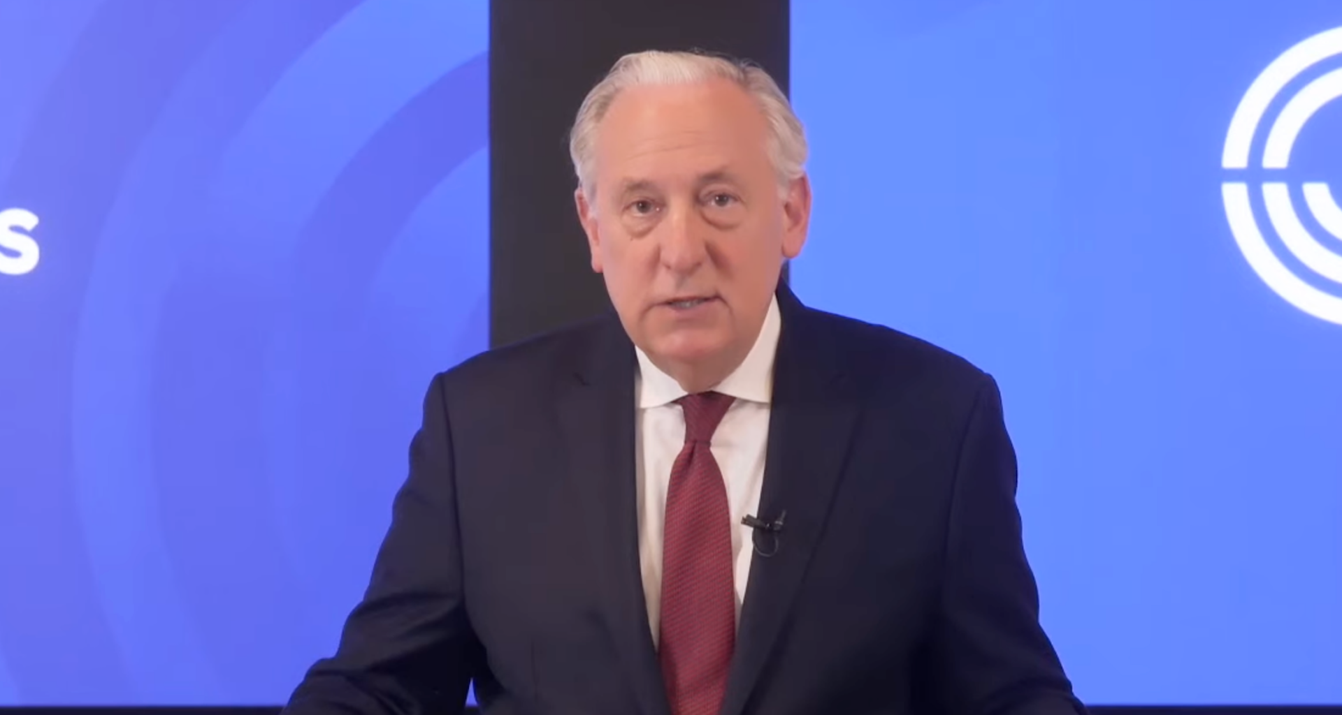 A photo of fingerhut speaking from a podium.