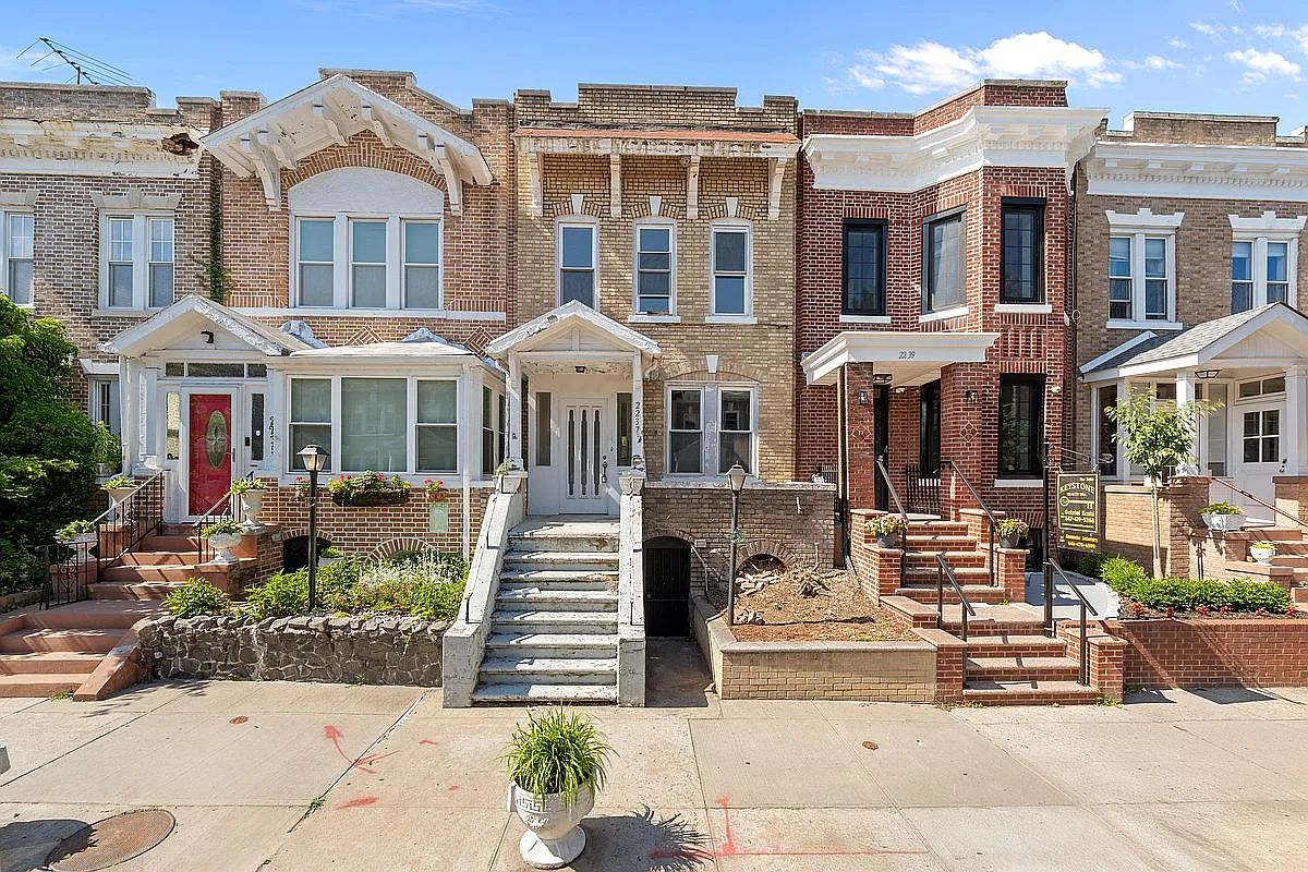 pale brick rowhouse exterior