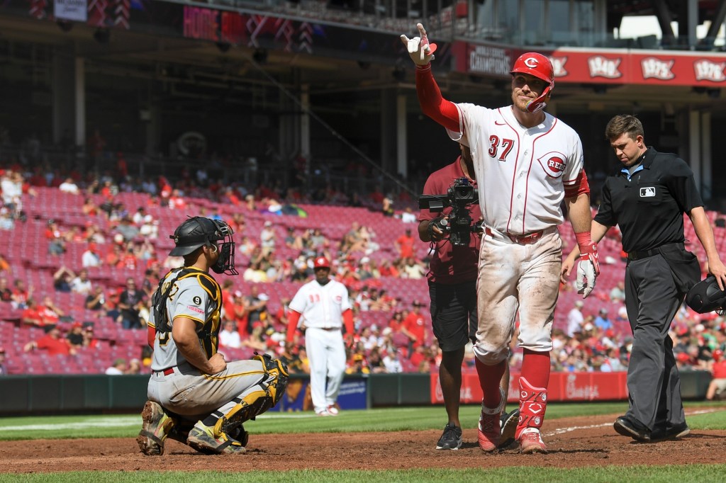 Cincinnati Reds' Tyler Stephenson (37) gestures after scoring a home run.
