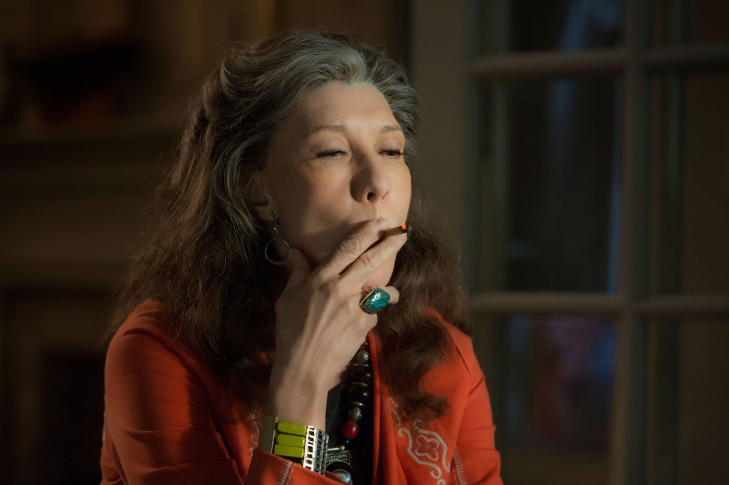 Lily Tomlin smoking a joint as Frankie in a scene from "Grace and Frankie."