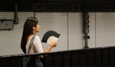 A passenger fans herself as she waits for a train on a sweltering subway platform at Canal Street in New York's Chinatown, Friday, July 19, 2013. A punishing heat wave continues to scorch New York, threatening to break heat records and putting a huge strain on the state s overworked power grid.