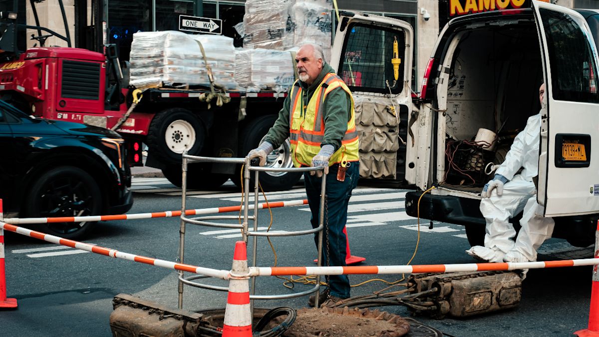 Mystery trio in headlamps and overalls emerges from Manhattan manhole, prompting NYPD probe