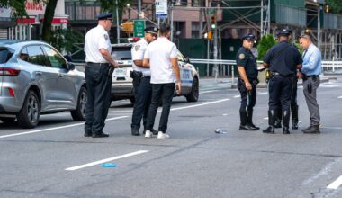 Man lying in Bronx street run over by two vehicles, including marked NYPD SUV