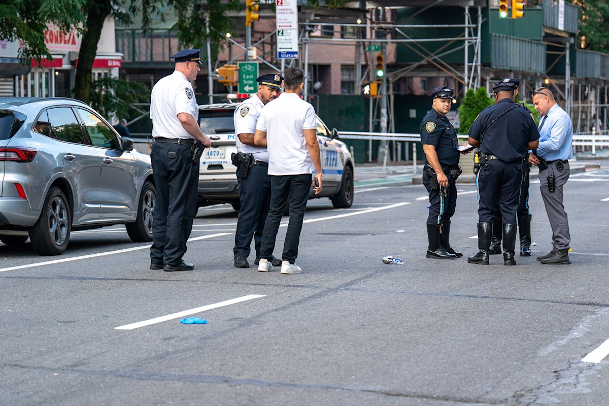 Man lying in Bronx street run over by two vehicles, including marked NYPD SUV