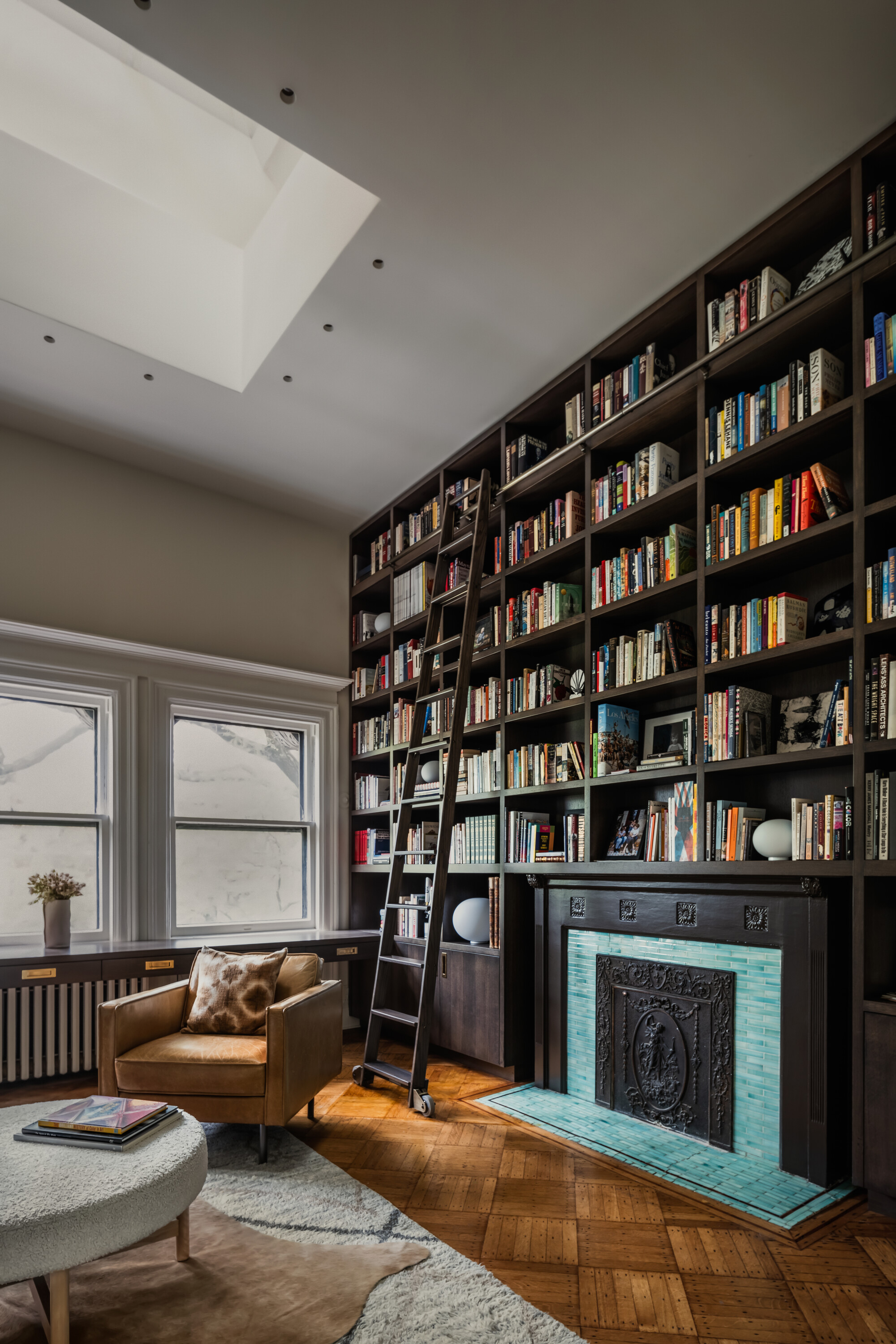 TOP FLOOR LIBRARY WITH SKYLIGHT BLACK BOOKSHELVES