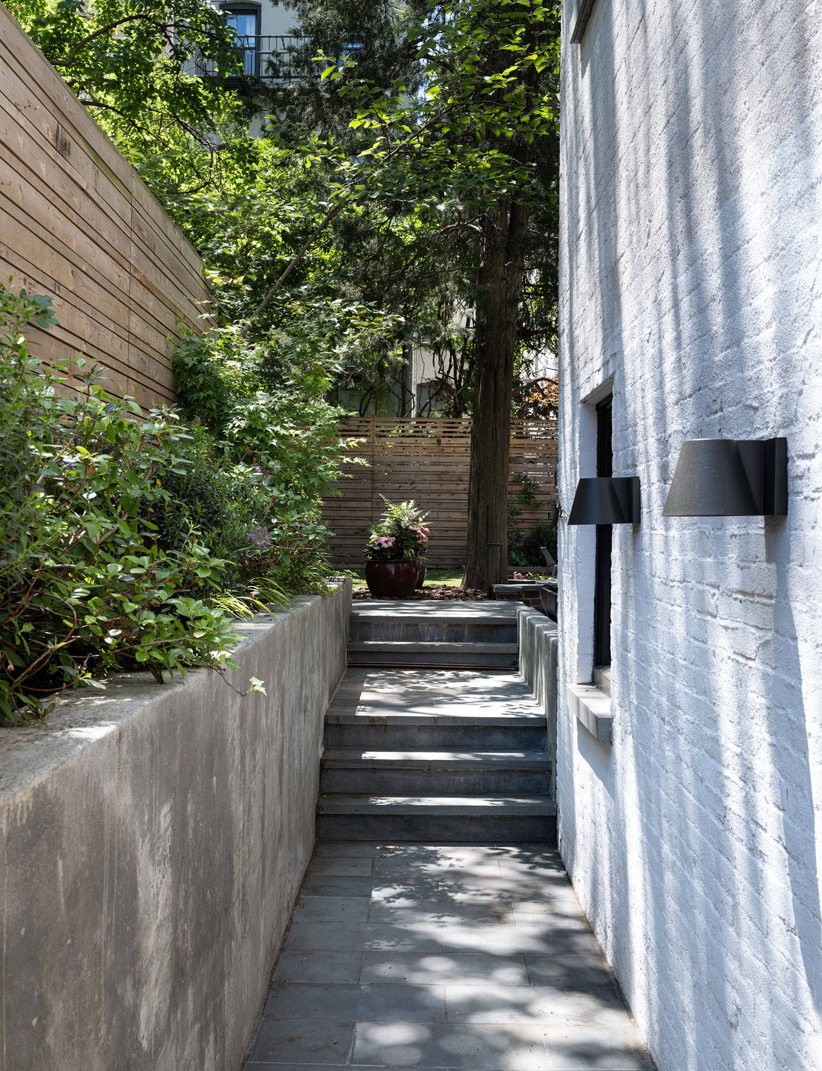 WELL ALONGSIDE HOUSE EXTERIOR REAR
