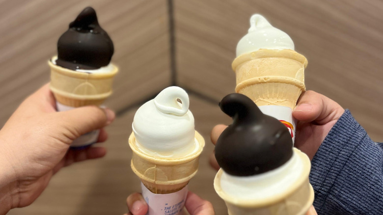 Four Dairy Queen ice creams in cones