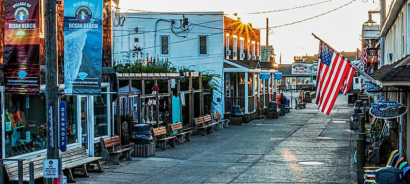 Ocean Beach, New York: Early morning view of downtown Ocean Beach on Fire Island as the sun rises over the businesses.