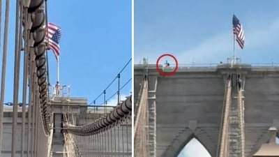 Naked man jumps from Brooklyn Bridge after affixing multiple flags, miraculously survives (@m_alejandr07/X)
