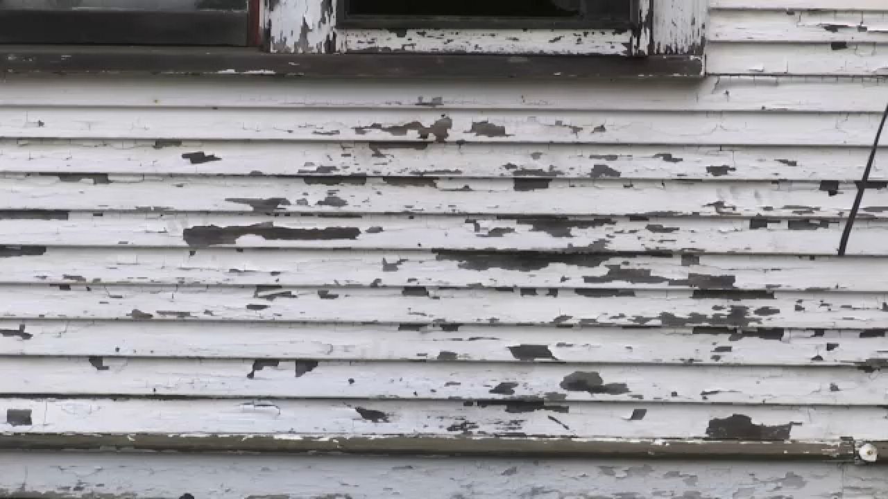 Paint chipping off a house