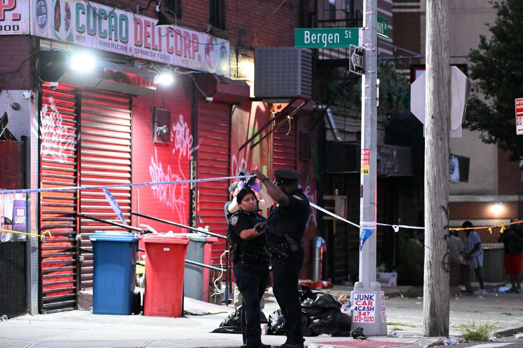 NYPD crime scene unit at the scene of a fatal shooting at Bergen Street and Howard Avenue in Brooklyn, New York.