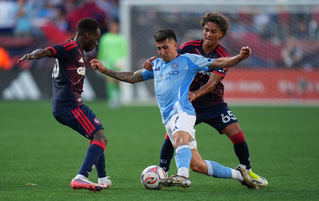 New England Revolution players Judah Siqueira (65) and Alhassan Yusuf (80) defend against New York City FC midfielder Nicolás Fernández (7).