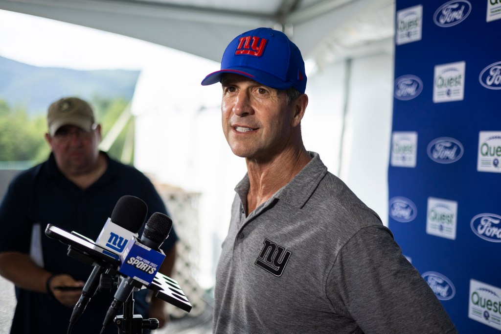 New York Giants head coach John Harbaugh speaks to the media during training camp.