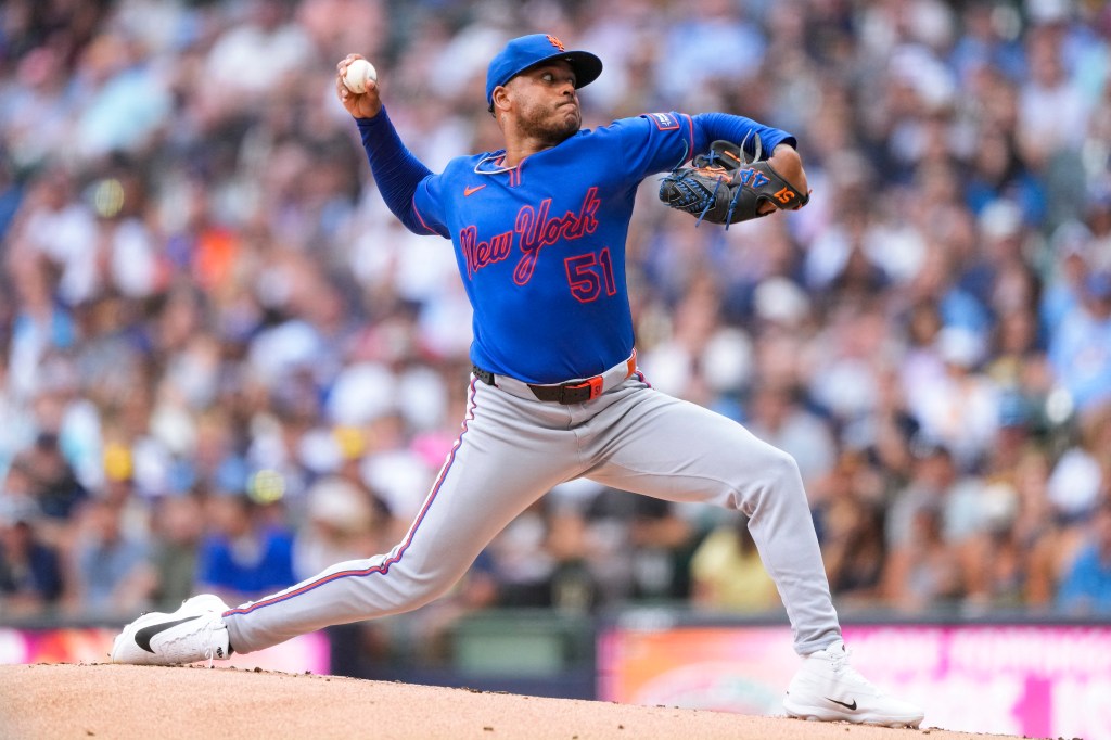 New York Mets pitcher Freddy Peralta (51) throws a pitch during a game against the Milwaukee Brewers.