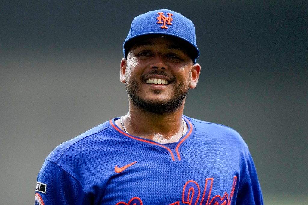 New York Mets pitcher Freddy Peralta (51) smiling.