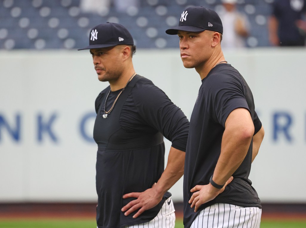 Giancarlo Stanton (L.) looks on prior to the Yankees-Cardinals game on Aug. 5, 2026. 