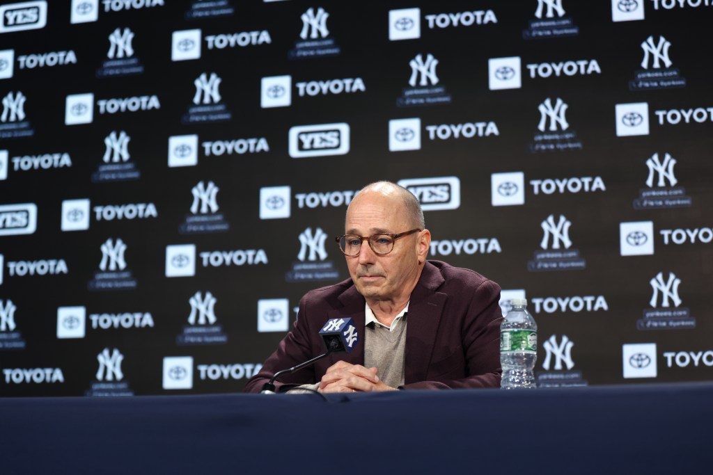 New York Yankees GM Brian Cashman speaking at a press conference.