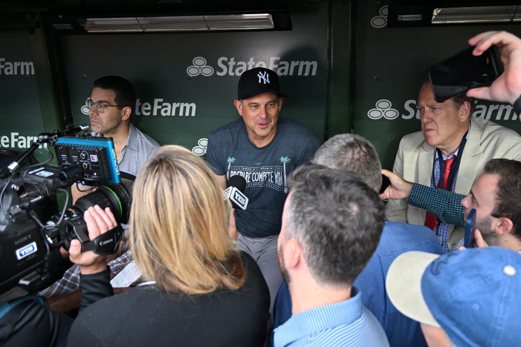 New York Yankees manager Aaron Boone speaking with media prior to a game.