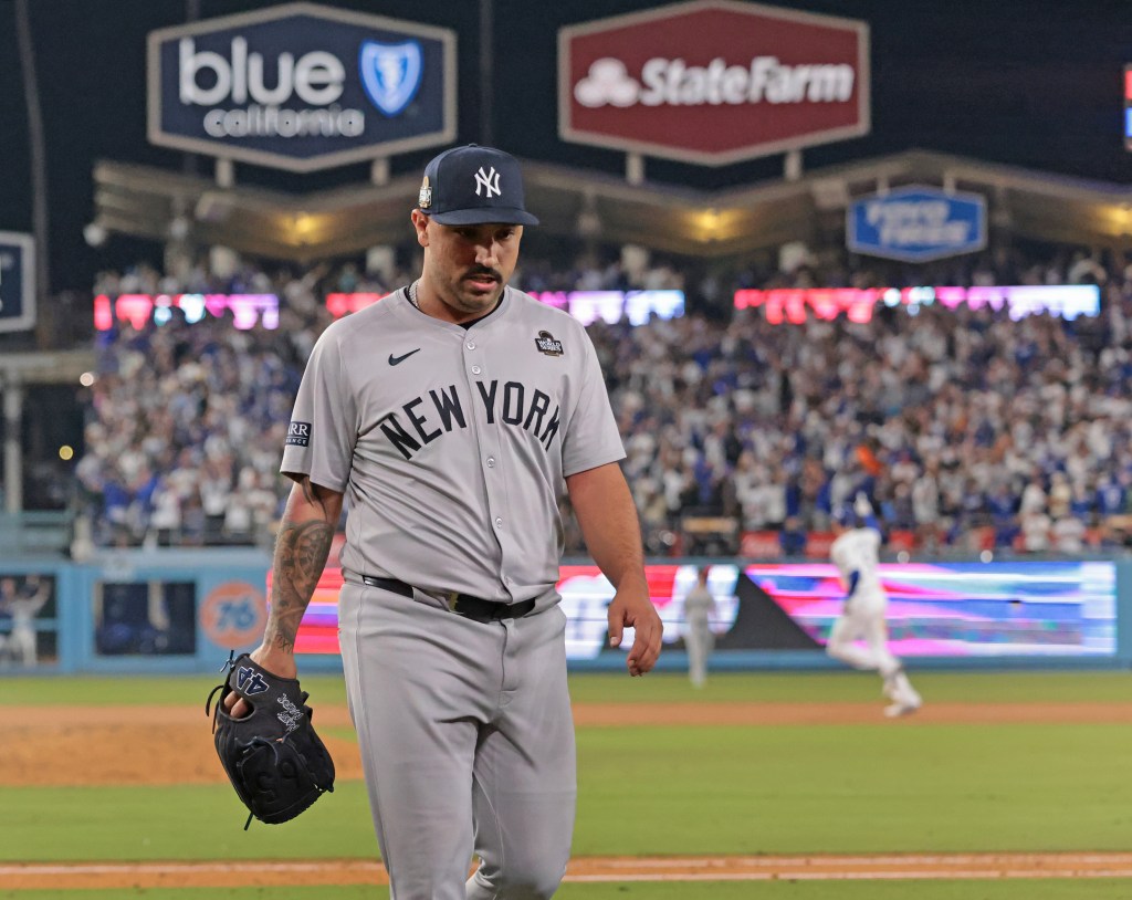 New York Yankees pitcher Nestor Cortes walks off the field after giving up a walk-off grand slam.