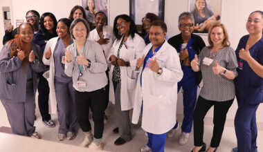 Labor and delivery team members celebrate their re-designation in place until the 2032 review.