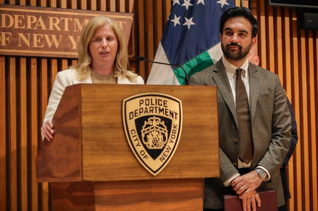 Jessica Tisch, NYPD Commissioner, speaking at a podium with Zohran Mamdani, New York City Mayor, standing to her right.