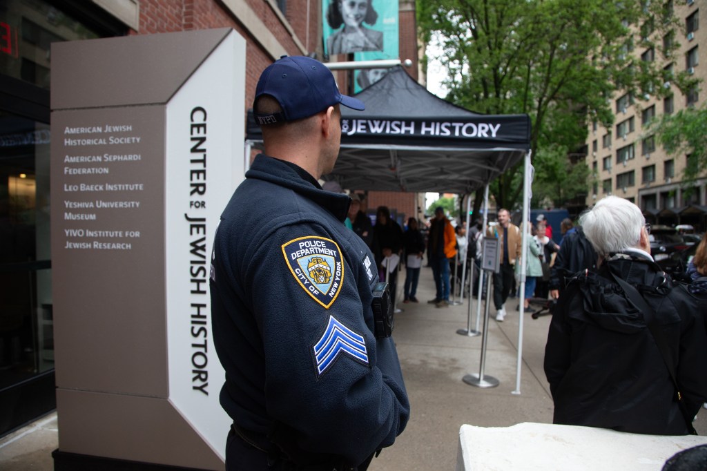 An NYPD Counterterrorism officer stands outside the Center for Jewish History.