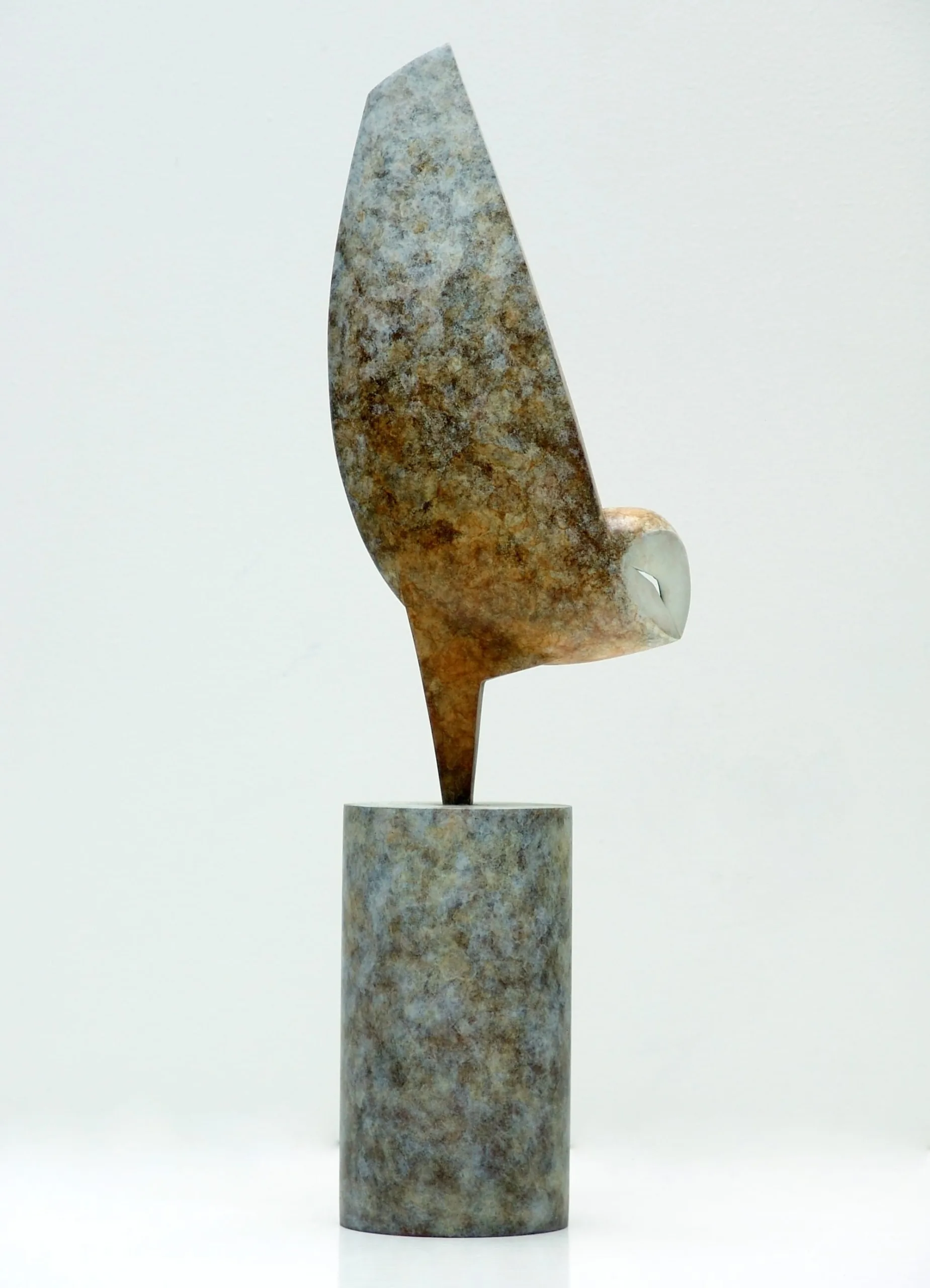 Anthony Theakston's bronze sculpture 'Spirit Owl' stands elegantly with outstretched wings.
