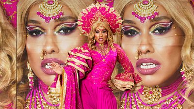 Drag Queen Roy wearing a pink south asian inspired dress with gold details
