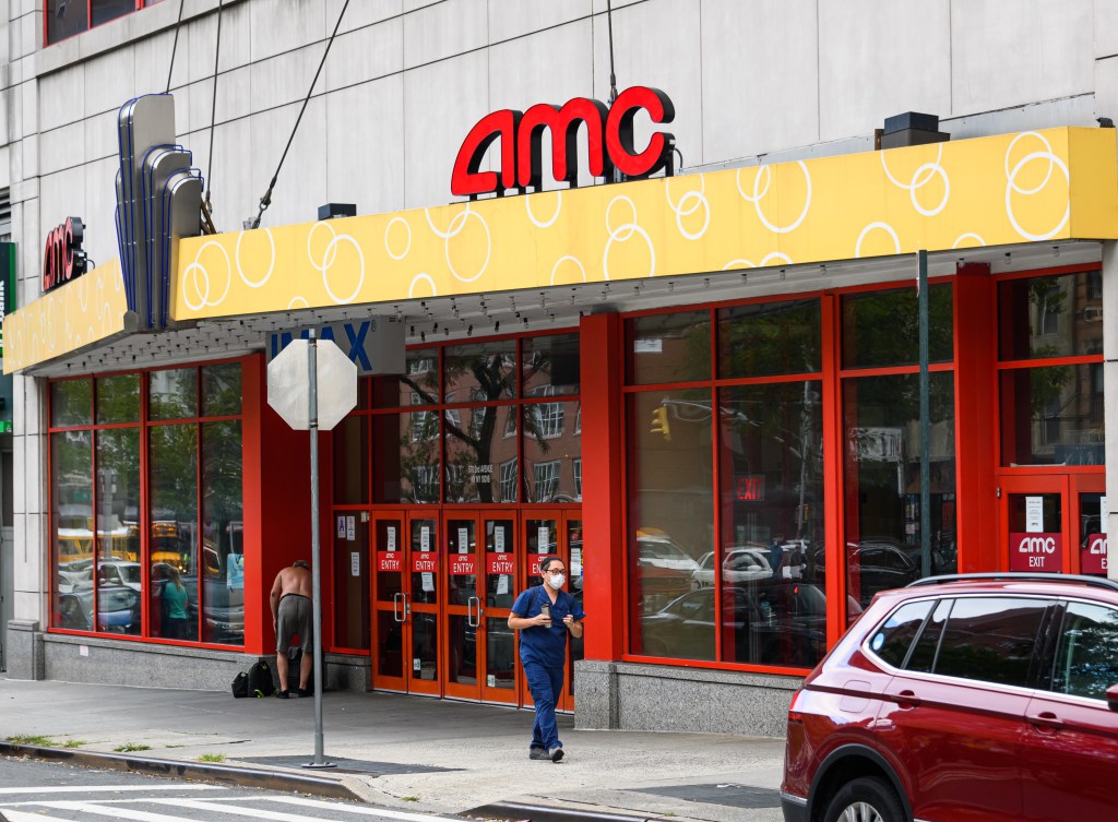 A person wears a protective face mask outside AMC Kips Bay 15 movie theater in Kips Bay on Monday, August 17, 2020, in New York City. The city is continuing Phase 4 of reopening following restrictions imposed to slow the spread of coronavirus.