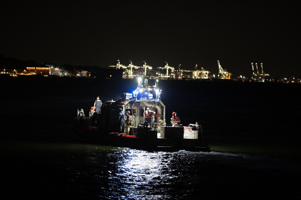 Police officers search for a possible person in the water in Brooklyn Bridge Park in Brooklyn on August 8, 2026. 