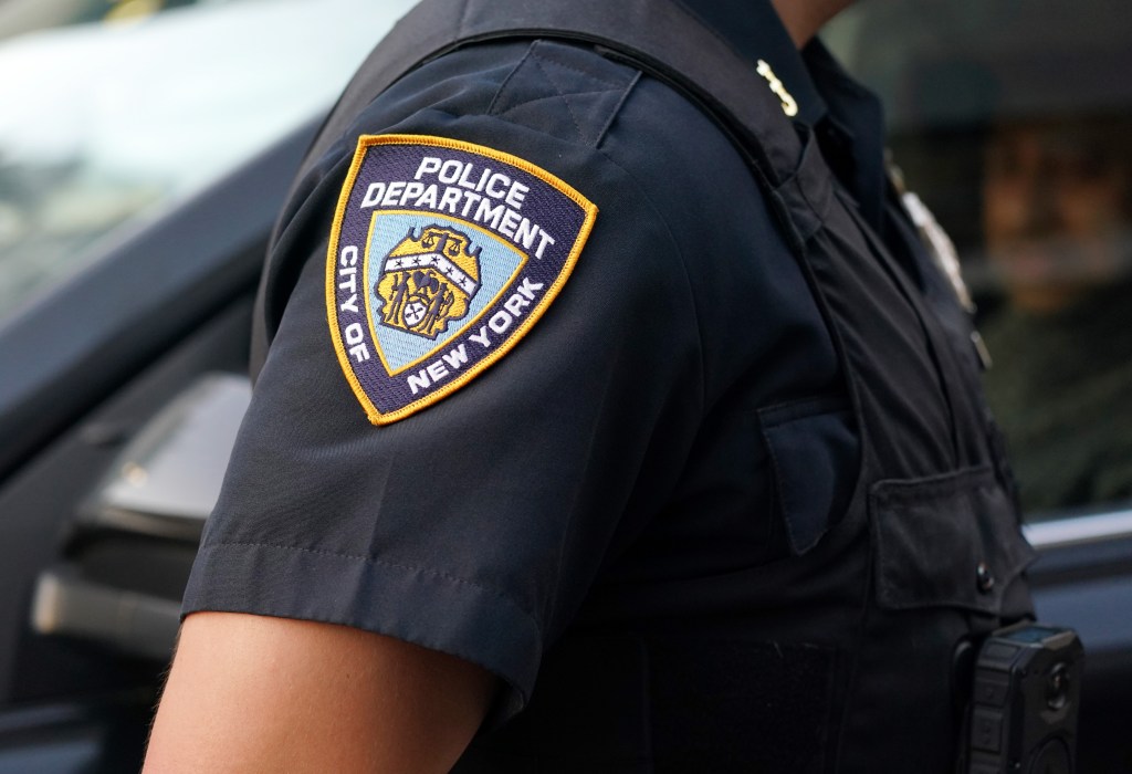An NYPD officer's uniform with an arm patch that reads "POLICE DEPARTMENT CITY OF NEW YORK."
