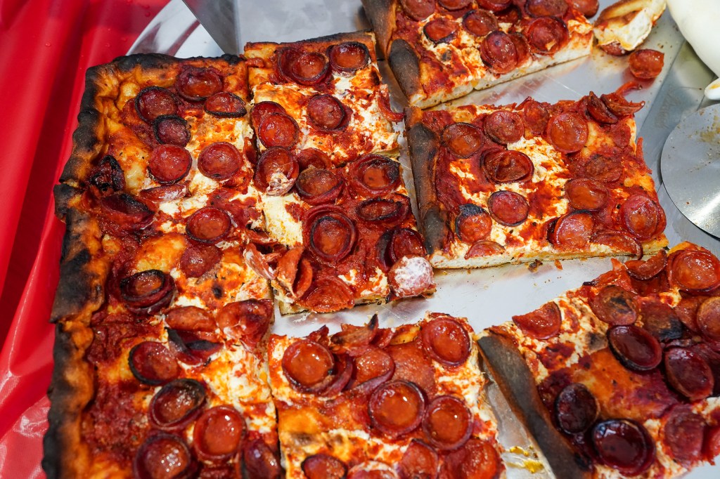 Prince St. pepperoni pizza served in rectangular slices.