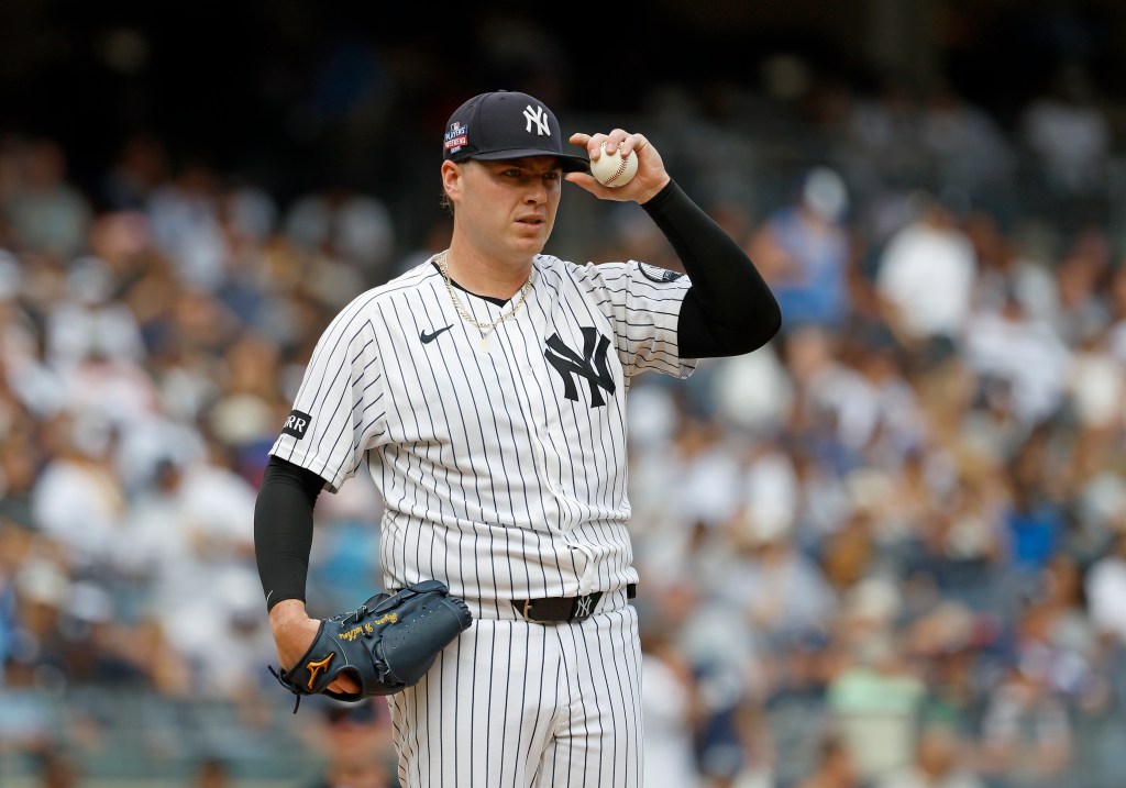 New York Yankees pitcher Ryan Weathers reacting on the mound.