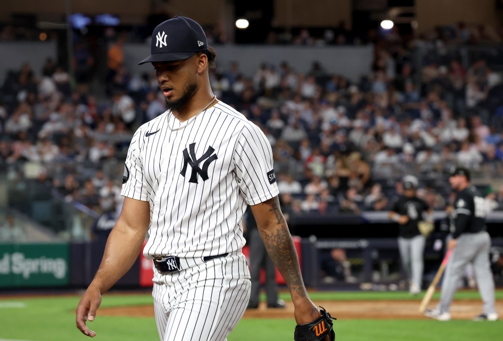 New York Yankees pitcher Camilo Doval (75) reacts as he walks back to the dugout after ending the 8th inning.