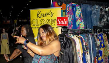 people posing by clothes