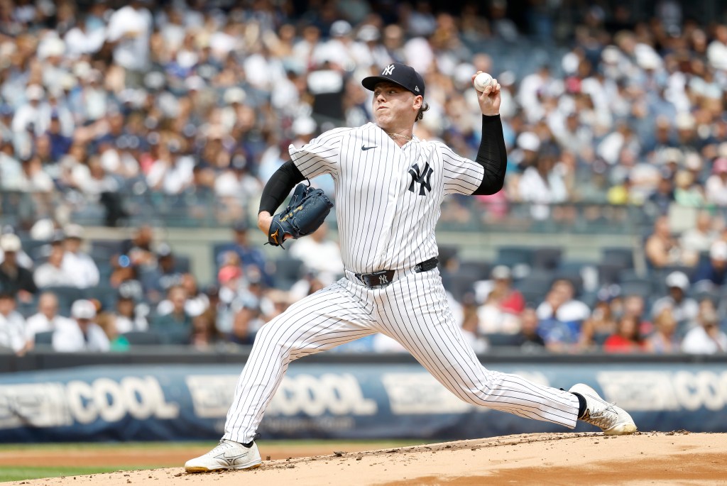New York Yankees pitcher Ryan Weathers throws a pitch.