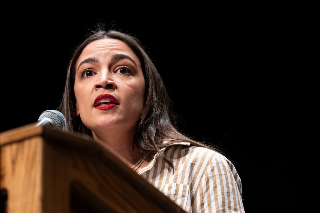 Alexandria Ocasio-Cortez speaking at a rally.