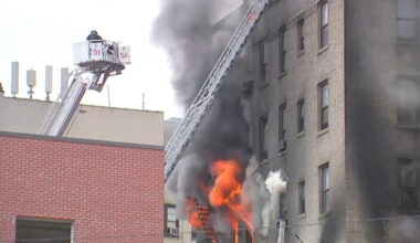 Fire crews battle a large fire at an apartment building in the Bronx