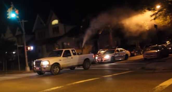 FILE - A Health Department-contracted truck sprays pesticide to combat mosquitoes carrying the West Nile virus.