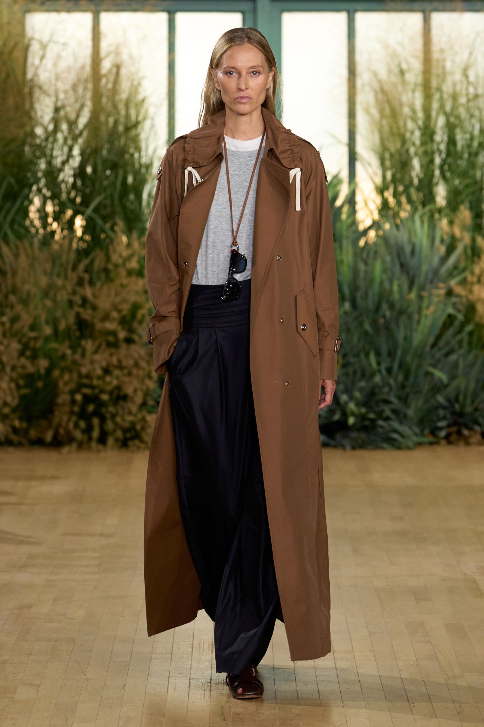 Image may contain Erin Daniels Clothing Coat and Overcoat