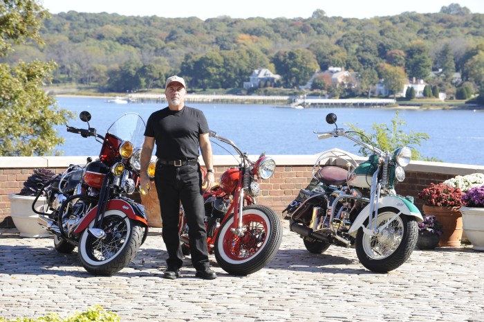 Billy Joel poses with motorcycles from his personal collection.