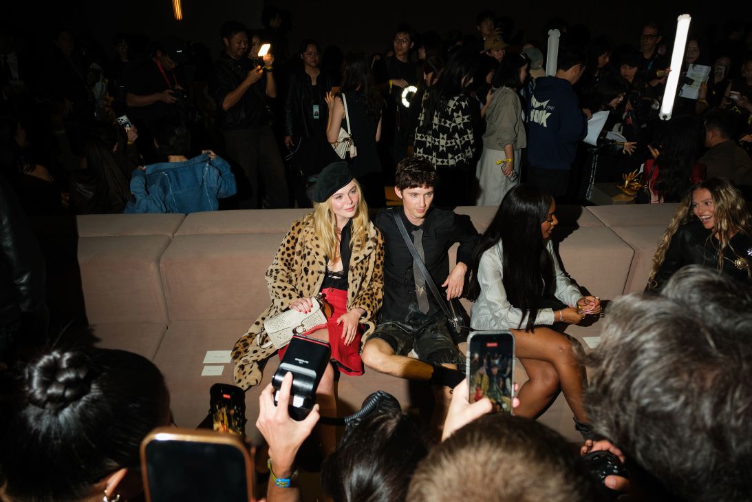 Elle Fanning and Troye Sivan take in the scene at Coach during New York Fashion Week.