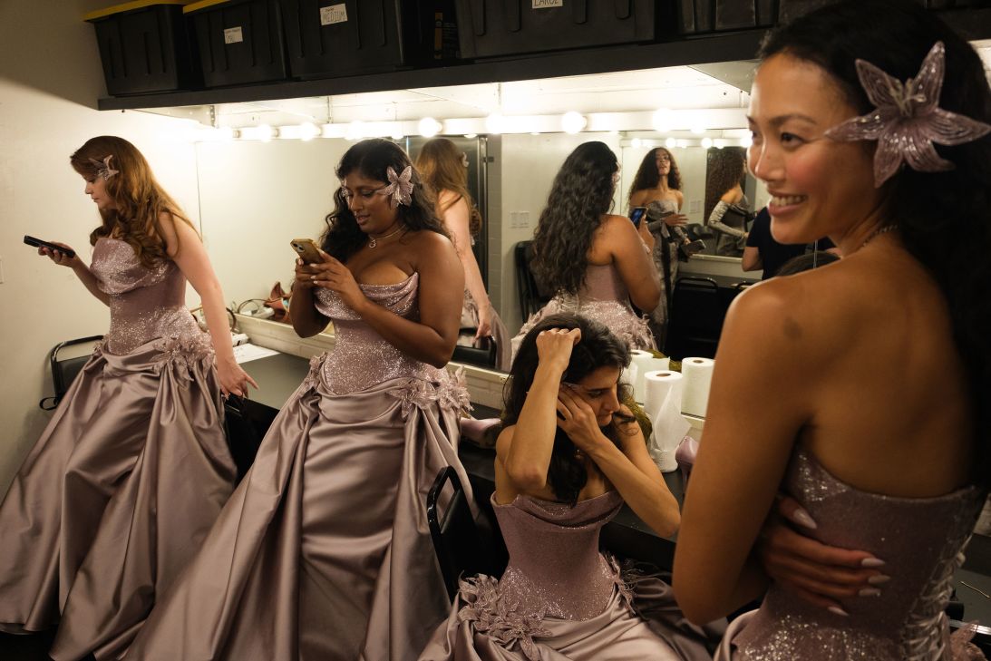 Models wait backstage before the start of the Wiederhoeft show.