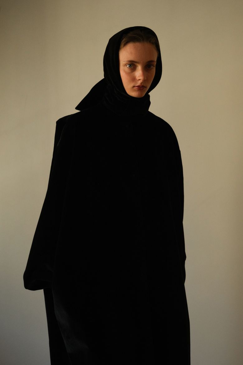 A stark black coat courtesy of Colleen Allen.