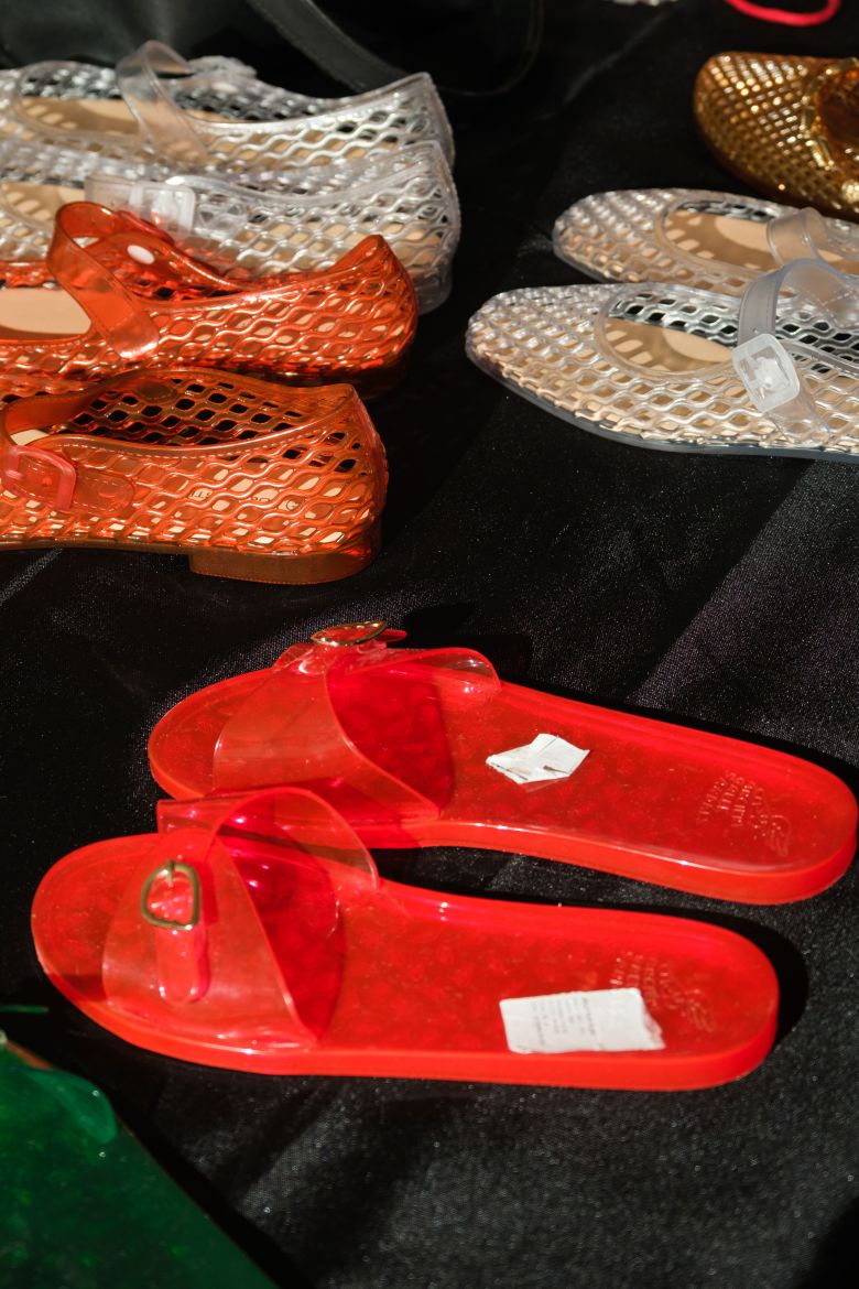 An array of jelly flat sandals for the models to wear at Aisling Camps.