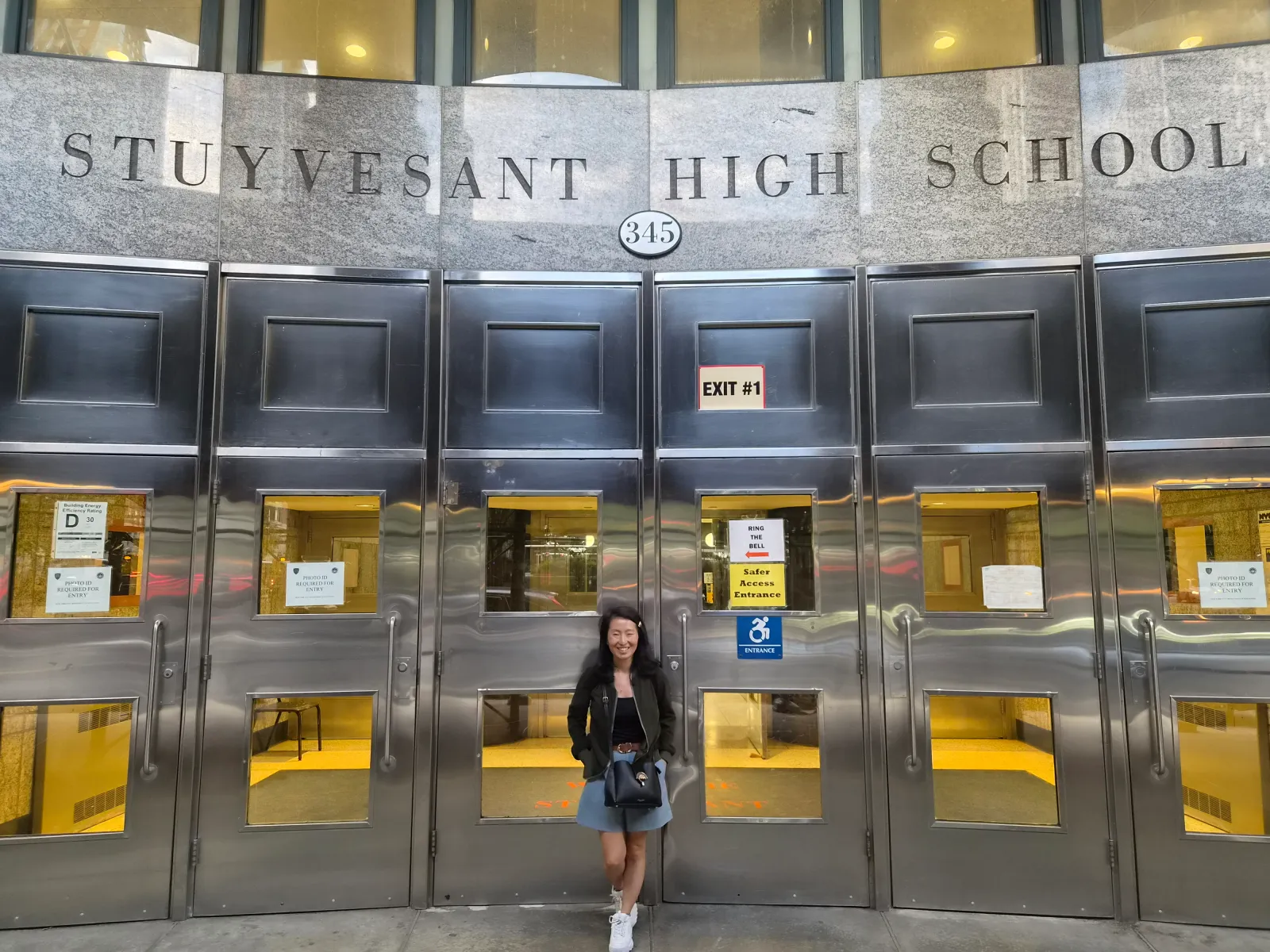Soo Kim outside the entrance of Stuyvesant High School.