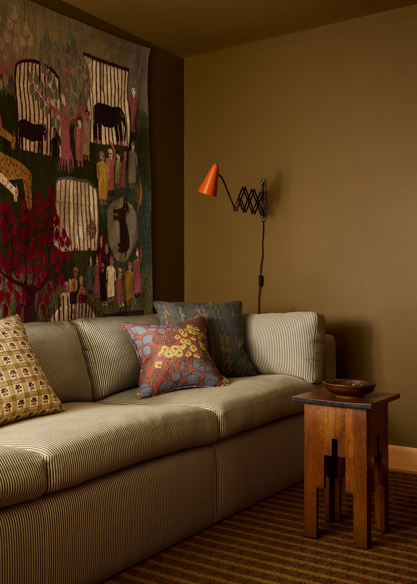 Image may contain Home Decor Couch Furniture Cushion Architecture Building Indoors Living Room Room and Lamp