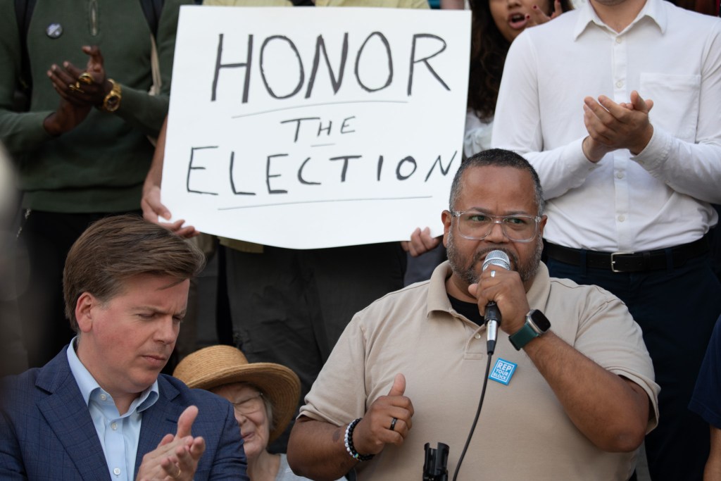 District Leader Julio Peña III speaks on the steps of Brooklyn Borough Hall about his support to lead the boroughs Democratic party,