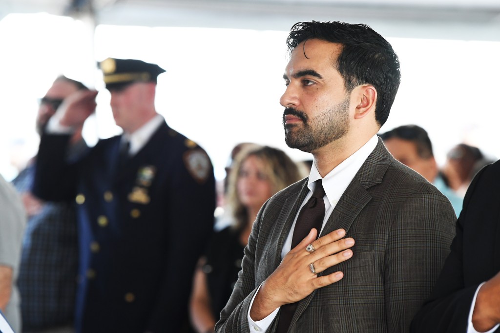 NYC Mayor Zohran Mamdani with his hand over his heart on Rikers Island.