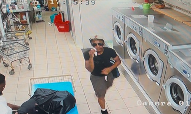 Christopher Davey is seen leaving an East Flatbush laundromat on Friday, minutes before he was fatally stabbed.